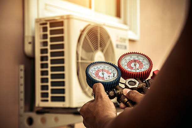 Professional Heat Pump Repair technician working in Arcola, IN